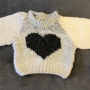 Hand knitted jumper for a doll or bear