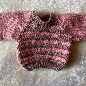 Hand knitted jumper for a doll or bear