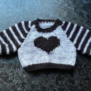 Hand knitted jumper for a doll or bear