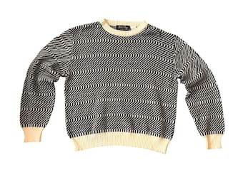 Jersey de punto vintage de los 80 con rayas geométricas, negro y crema, corte holgado, hombros caídos, talla XL.
