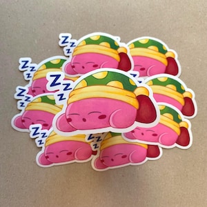 Niedlicher Computerspiel Sticker von einem verschlafenen rosa Kerl