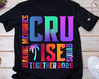 May include: Black t-shirt with a rainbow colored graphic that says "Cruise is making memories together 2023" with a palm tree graphic.