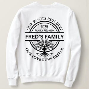 May include: White long-sleeve sweatshirt with a black graphic of a tree with roots and the text "Our roots run deep, 2025 Family Reunion, Fred's Family, Our love runs deeper".