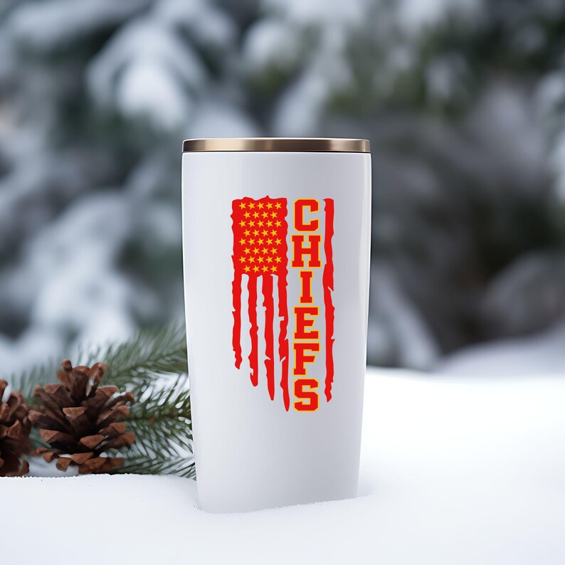 May include: White travel mug featuring a red, white and blue American flag design with the word "CHIEFS" in yellow lettering.