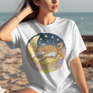 Cute Cat on Moon T-Shirt, Cartoon Cat and Stars Graphic Tee, Adorable Pet Lover Shirt, Casual Wear, Animal Cartoon T-Shirt Design