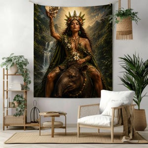 May include: A wall tapestry featuring a person with long dark hair wearing a floral crown and green foliage attire, riding a tapir in a jungle setting with a waterfall. The person holds a skull aloft against a bright sunlit sky background.