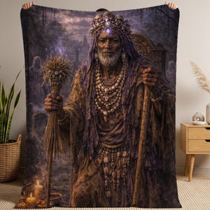May include: A blanket featuring a detailed illustration of an elder figure adorned with a crown, layered necklaces, and a long robe. The artwork has a mystical theme, with a staff and a bundle of wheat in hand, set against a dark, atmospheric background.