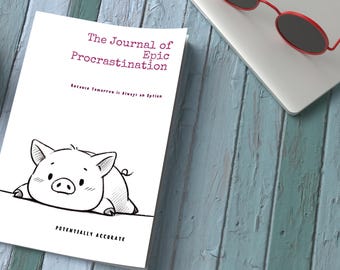 May include: A white journal titled "The Journal of Epic Procrastination" with a cartoon pig illustration. The text "Because Tomorrow is Always an Option" and "Potentially Accurate" are also visible. Red sunglasses rest on a laptop.