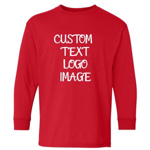 May include: A long-sleeved red shirt with the words "CUSTOM TEXT LOGO IMAGE" in white, stacked vertically. The shirt is made of a soft material and is suitable for customization with a logo or image.