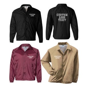 May include: A collection of four coach jackets in black, maroon, and tan. Each jacket features a pointed collar, snap-button front closure, and long sleeves with elastic cuffs. The text CUSTOM LOGO is printed on the chest, and the back displays CUSTOM LOGO TEXT.