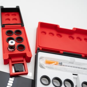 May include: A set of three ceramic mugs with a speckled, matte finish. Each mug features a different color: light blue, cream, and gray. The mugs have a simple, modern design and a comfortable handle.