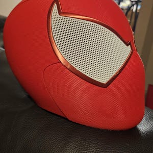 May include: A white ceramic mug with a black handle and the text "But First, Coffee" in a black, handwritten-style font. The mug is on a white surface.