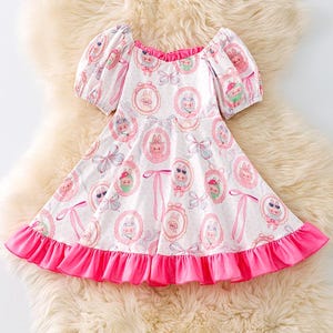 Labubu girls printed dress with pink ruffle hem. DRG51902