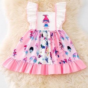 Multi-Printed cartoon character printed ruffle hem dress. DRG51319