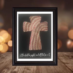 May include: A framed print of a baseball cross with the text "Let the field be joyful, and all that's in it".