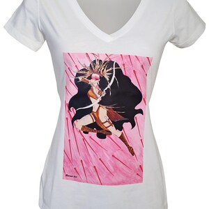 May include: White v-neck t-shirt with a pink and white illustration of a woman with a bow and arrow. The woman is wearing a brown leather outfit and a black cape. The illustration is surrounded by pink arrows. The text "Miriam Art" is in the bottom left corner of the illustration.