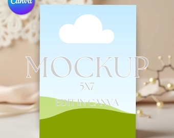 May include: A mockup of a 5x7 inch card with a blue sky, white cloud, and green grass. The text "MOCKUP" and "EDIT IN CANVA" are on the card.