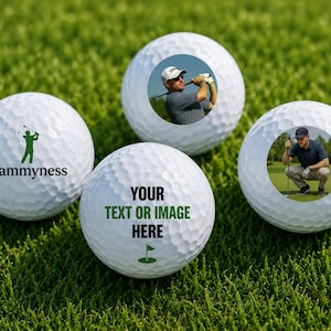 May include: Four white golf balls with dimpled surfaces. One features a green golfer silhouette and the text sammyness. Another shows a golfer swinging a club. A third displays a golfer crouching. The fourth has the text YOUR TEXT OR IMAGE HERE.