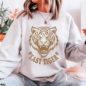 Easy Tiger Shirt, Retro Boho Aesthetic Tee, Unisex Oversized Graphic Tee, Trendy Hippie Clothes & Gifts, Vintage Indie Shirt, Bella+Canvas® 3001 T-Shirt, Gildan Sweatshirt & Hoodie, funny tripping shirt, vintage tee designs, aesthetic trendy top, easy tiger gifts, fun gifts for sister, shirts that go hard, comfy indie fashion, feminist sassy shirt, festival clothing, plus sizing bff gift, retro boho aesthetic