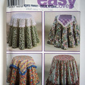 May include: A sewing pattern for making tablecloths. The pattern includes four different designs, each with a different floral print. The pattern is titled "Design Your Own Easy Table Covers".