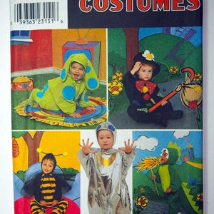 May include: Simplicity Costumes sewing pattern number 8814, size A (1/2, 3, 4).  The pattern includes five different costumes: a caterpillar, a clown, a bee, an astronaut, and a dragon.  The pattern is illustrated with children wearing the costumes.