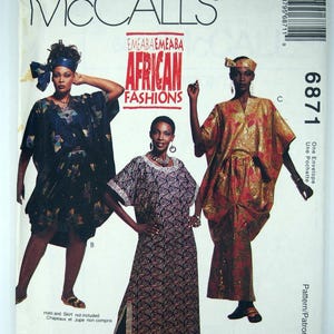 May include: McCall's sewing pattern featuring African fashions. The pattern includes designs for three different outfits: a dark blue caftan, a patterned dress, and a red and gold ensemble. The pattern number is 6871.