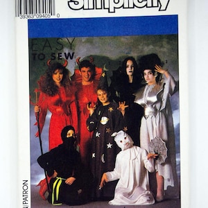 May include: Simplicity sewing pattern 9304 for adult and child costumes. The cover features a group of people in various Halloween costumes, including devils, a witch, and a ghost. The text "EASY TO SEW" is visible.