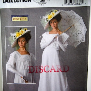 May include: A Butterick sewing pattern, B6610, featuring a woman in a white dress, hat, and gloves, holding a parasol. The pattern includes a smaller image of the dress and hat. The text "Making History" is visible.