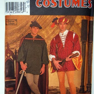 May include: Simplicity Costumes sewing pattern number 7761 for two Renaissance era costumes. The pattern includes a red and gold costume with a feathered hat and a green costume with a brown hat. The pattern is for sizes XS, S, M, L, and XL.
