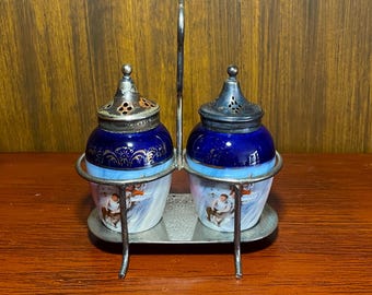 Vintage Sled Theme Salt and Pepper Shakers with Silver Plate Stand