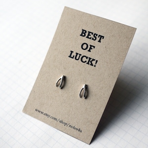 ¡La mejor de la suerte! ¡Dese pendientes de hueso!