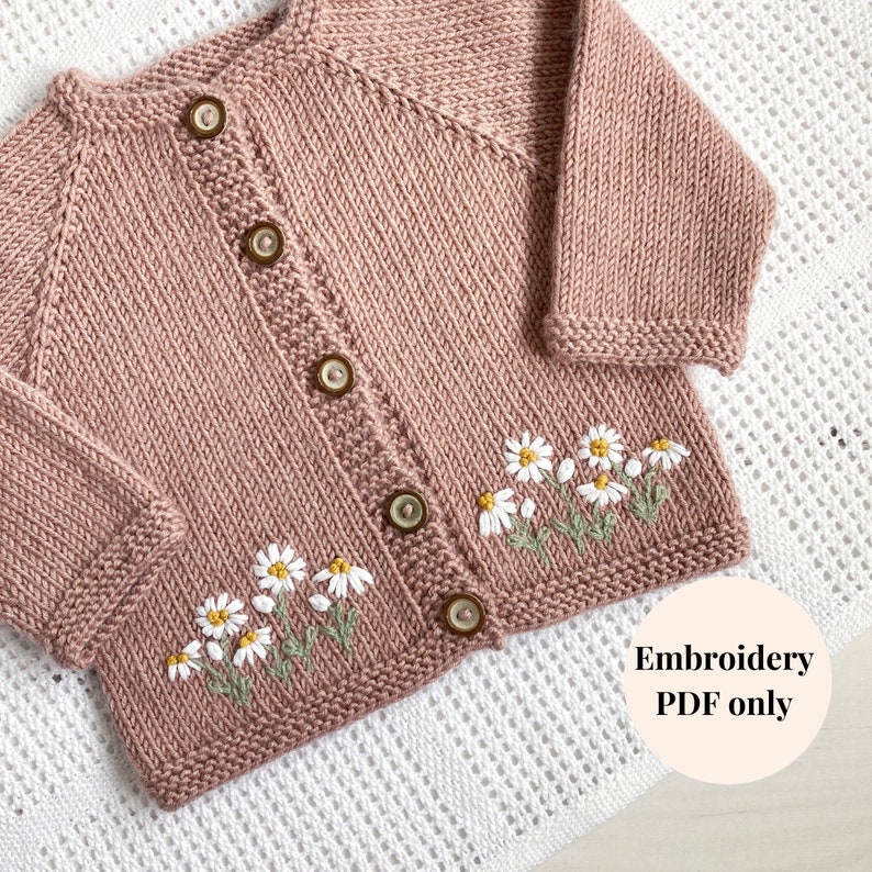 May include: A pink knitted cardigan with a button closure and embroidered daisies on the front. The text "Embroidery PDF only" is visible in the lower right corner of the image.