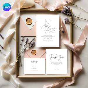 May include: A framed wedding invitation suite featuring a main invitation, RSVP card, and thank you card. The main invitation reads "Andrea and Martin" with the date "10.10.25". Envelopes with wax seals and lavender sprigs are also included.