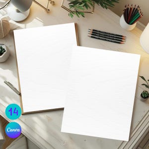 May include: Two blank white textured paper sheets on a wooden surface, with pencils, colored pencils, and a small succulent. The image includes the text "14" and "Canva" in a blue and purple circle.
