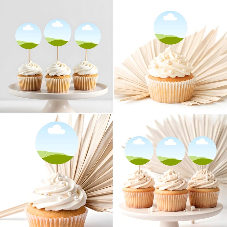 May include: Four cupcakes with white frosting and decorative toppers featuring a blue sky and green landscape design. The cupcakes are on a white cake stand, perfect for a party or celebration.
