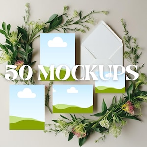 May include: A mockup design featuring five cards with a landscape design of a blue sky, white clouds, and green hills. A white envelope is in the background, surrounded by green and white floral arrangements. The text "50 MOCKUPS" is overlaid on the image.