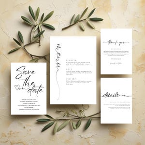 May include: Elegant wedding stationery set featuring a "Save the Date" card, menu, thank you note, and details card. The cards have minimalist black script on a white background, with olive branches for decoration. The text includes "Save the Date" and "menu".