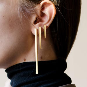 May include: A rustic wooden sign with the text "Welcome to our home" in a handwritten style. The sign has a distressed finish and a simple, inviting design, ideal for a front porch or entryway.