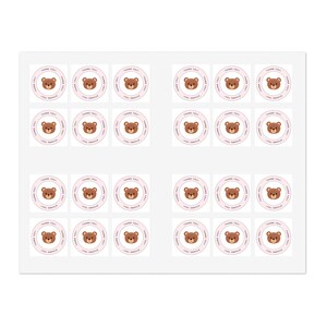 May include: A sheet of 24 round stickers featuring a brown bear with a pink nose and pink inner ears. The stickers have a pink border and the text "Thank You" in pink lettering.