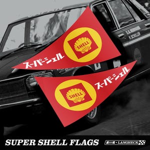 May include: Two red triangular flags with yellow circles and the Shell logo, and Japanese text. The flags are in front of a classic car. The text "SUPER SHELL FLAGS" is at the bottom.