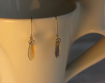 Iridescent Pink Glass Dagger Earring on leverback earwires.
