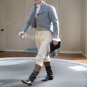 May include: A man wearing a light blue tailcoat with a white cravat and white shirt. He is wearing white breeches and brown leather boots. He is holding a black book in his right hand. The text "Regency Tailor" is visible in the image.