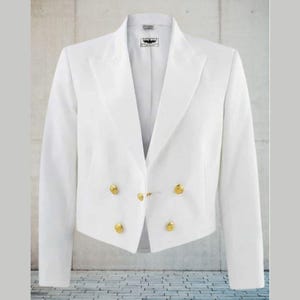 May include: A white blazer with a tailored fit, featuring a notched lapel and gold-colored buttons. The jacket has a double-breasted design with four buttons and a hook-and-eye closure. The garment is displayed against a neutral background.