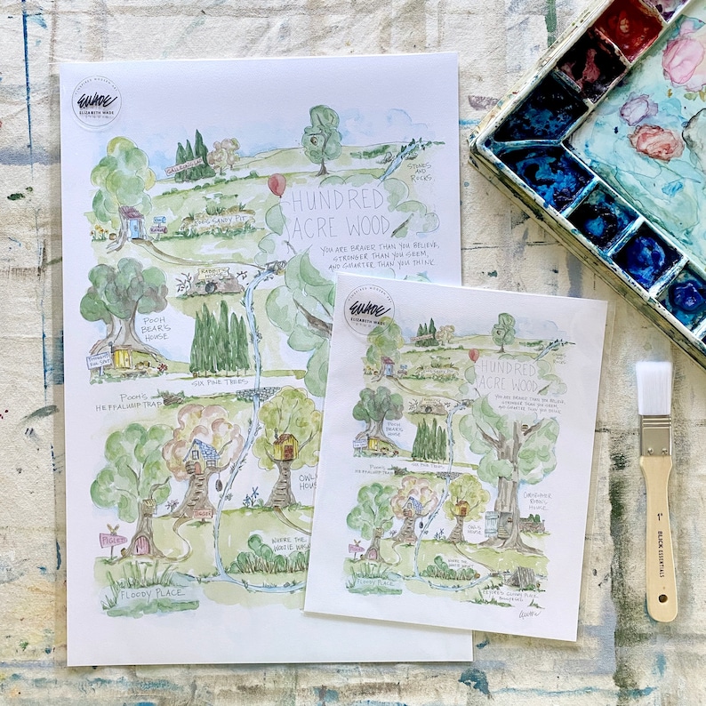 May include: A watercolor illustration of a map of Hundred Acre Wood from Winnie the Pooh. The map shows the locations of Pooh Bear's house, Piglet's house, Owl's house, and more. The map is surrounded by a green border and has a white background.