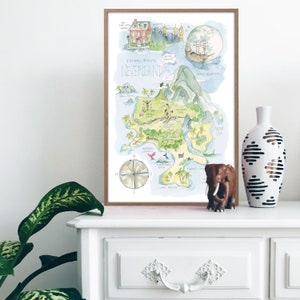 May include: A watercolor illustration of Peter Pan's Neverland, featuring a map of the island with various landmarks, including Skull Rock, Mermaid Lagoon, and the Jolly Roger ship. The map is surrounded by a light blue background with a white moon and stars.