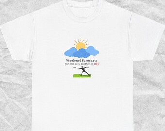 May include: White t-shirt with a graphic of a sunny sky and a person throwing a disc. The text reads "Weekend forecast: Disc golf with a chance of aces."