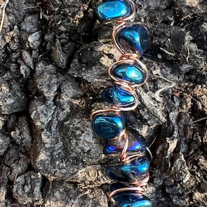Oil spill glass and copper cigarette holder ring