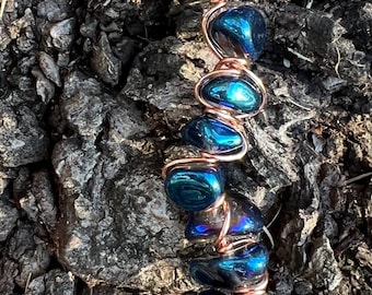 Oil spill glass and copper cigarette holder ring