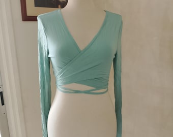 Organic cotton ballet wrap crop top, crossover long sleeve, minimalist style.