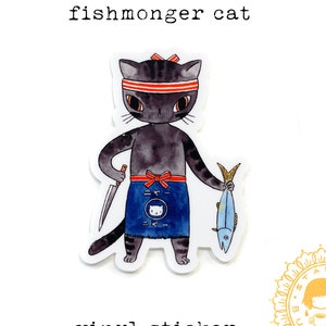 May include: A vinyl sticker with a watercolour illustration of a black cat fishmonger. The cat wears a red headband and apron, holding a knife and a fish. The text "fishmonger cat" and "vinyl sticker" are above and below the image.
